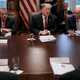 President Donald Trump (C) talks to reporters with Deputy Secretary of State John Sullivan (L) and Commerce Secretary Wilbur Ross during a meeting of his cabinet in the Cabinet Room at the White House February 12, 2019 in Washington, DC. Trump said he was not happy about the compromise legislation agreed to by Republicans and Democrats that would prevent a new partial federal government shutdown but said he would accept the deal.